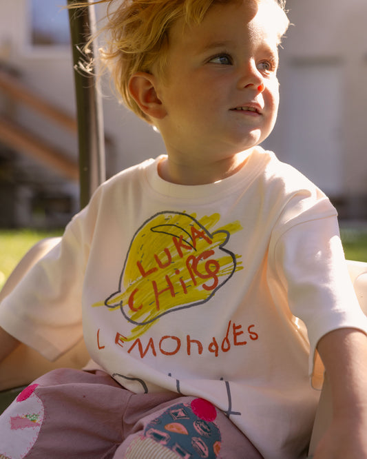 kids wearing a 100 % cotton graphic tee.