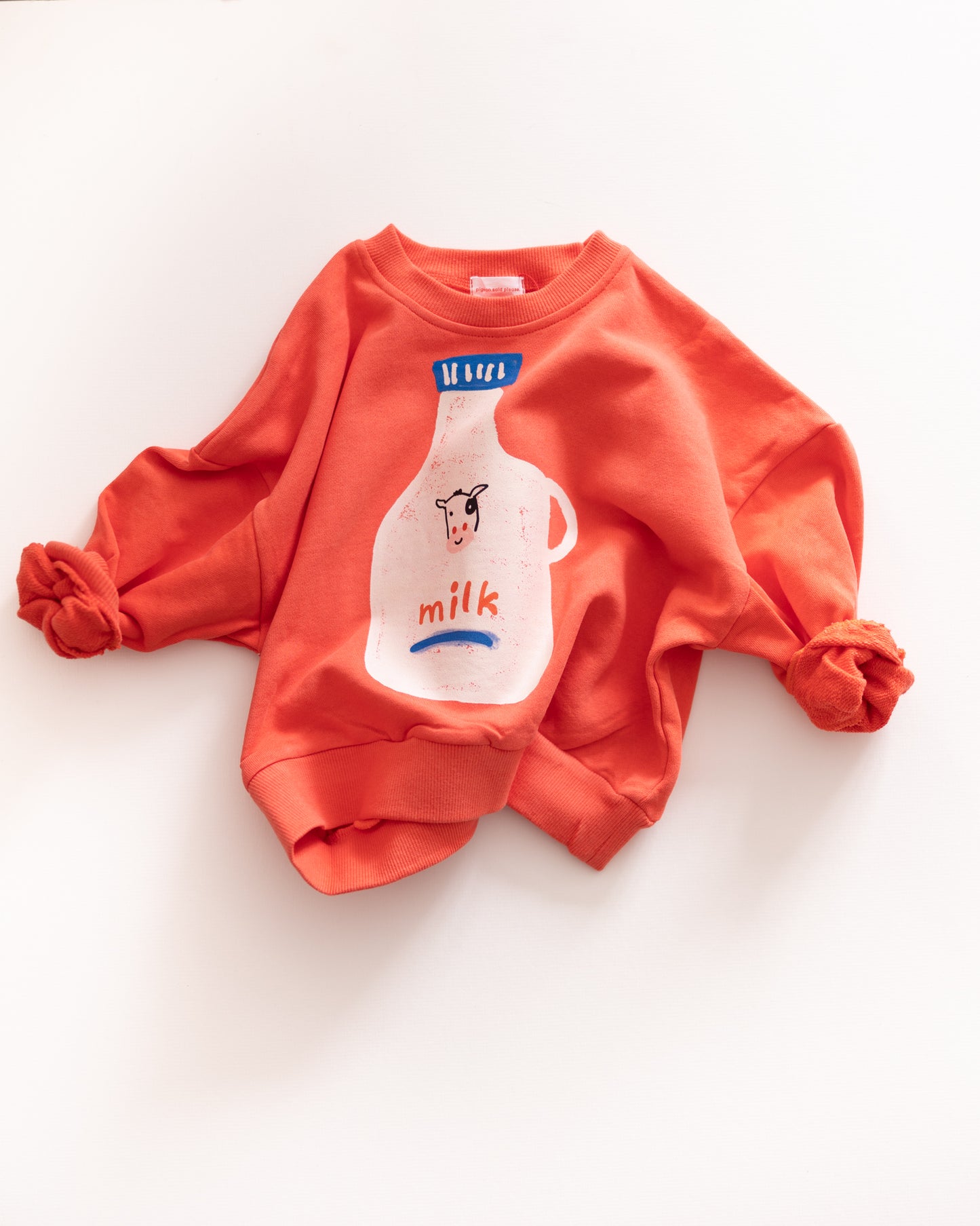 Red sweatshirt with a milk carton design on a white background