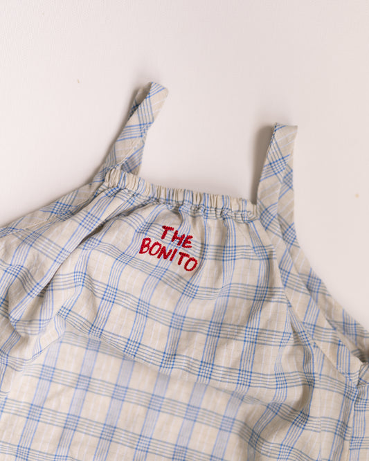 Plaid dress with 'The Bonito' label on a white background