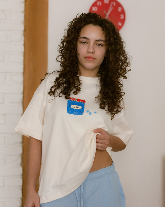 woman wearing a blueberry jam graphic t-shirt